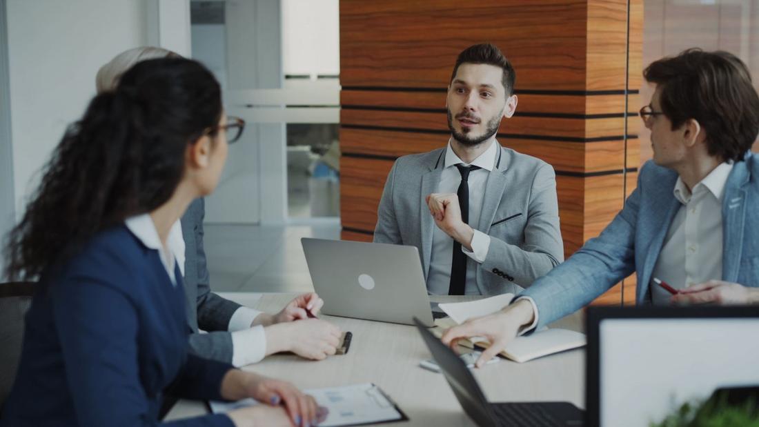 A corporate communications team in a meeting